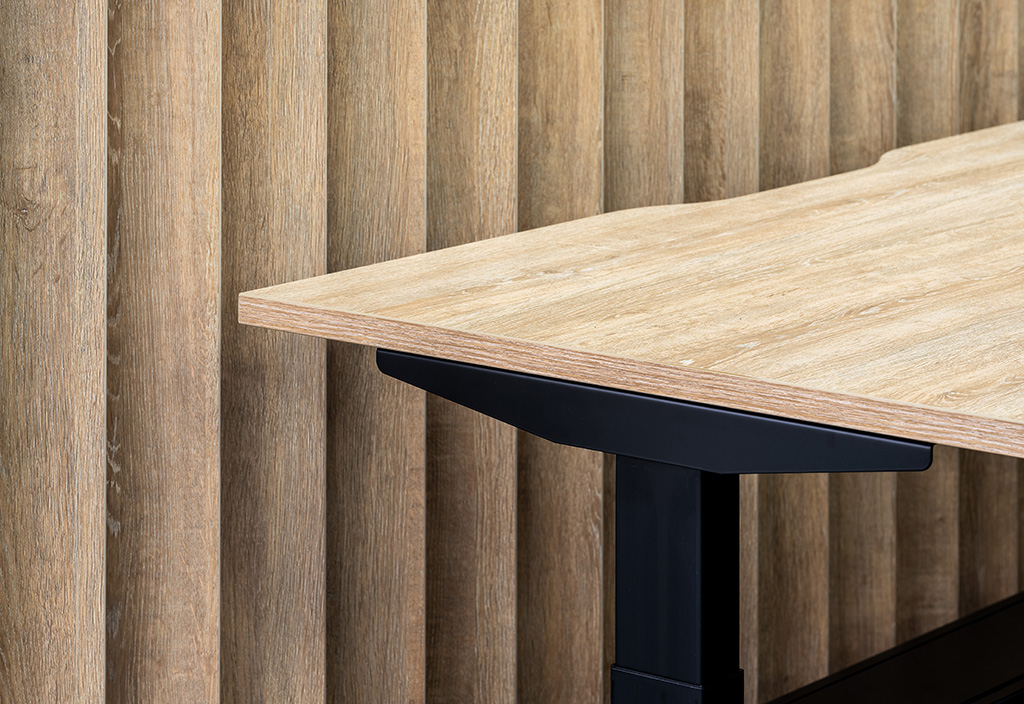 Close up detail of timber slat wall and height adjustable workstation/desk