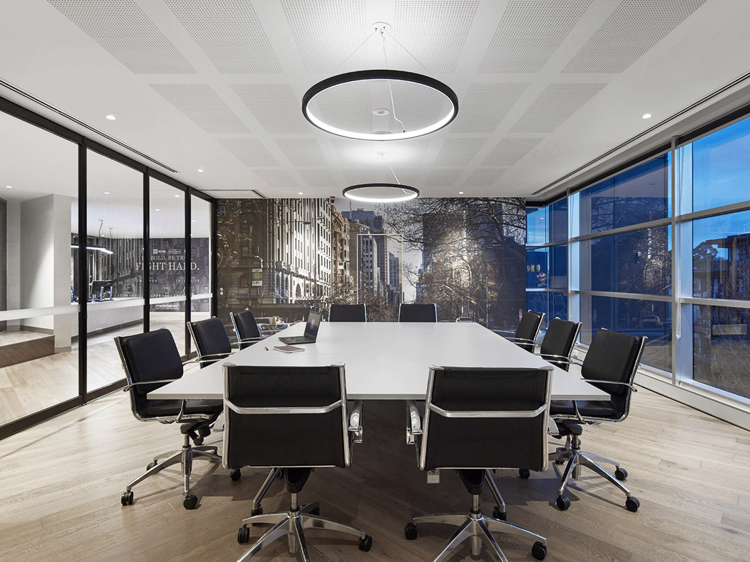 Axis flip boardroom table with white melamine top in modern boardroom setting