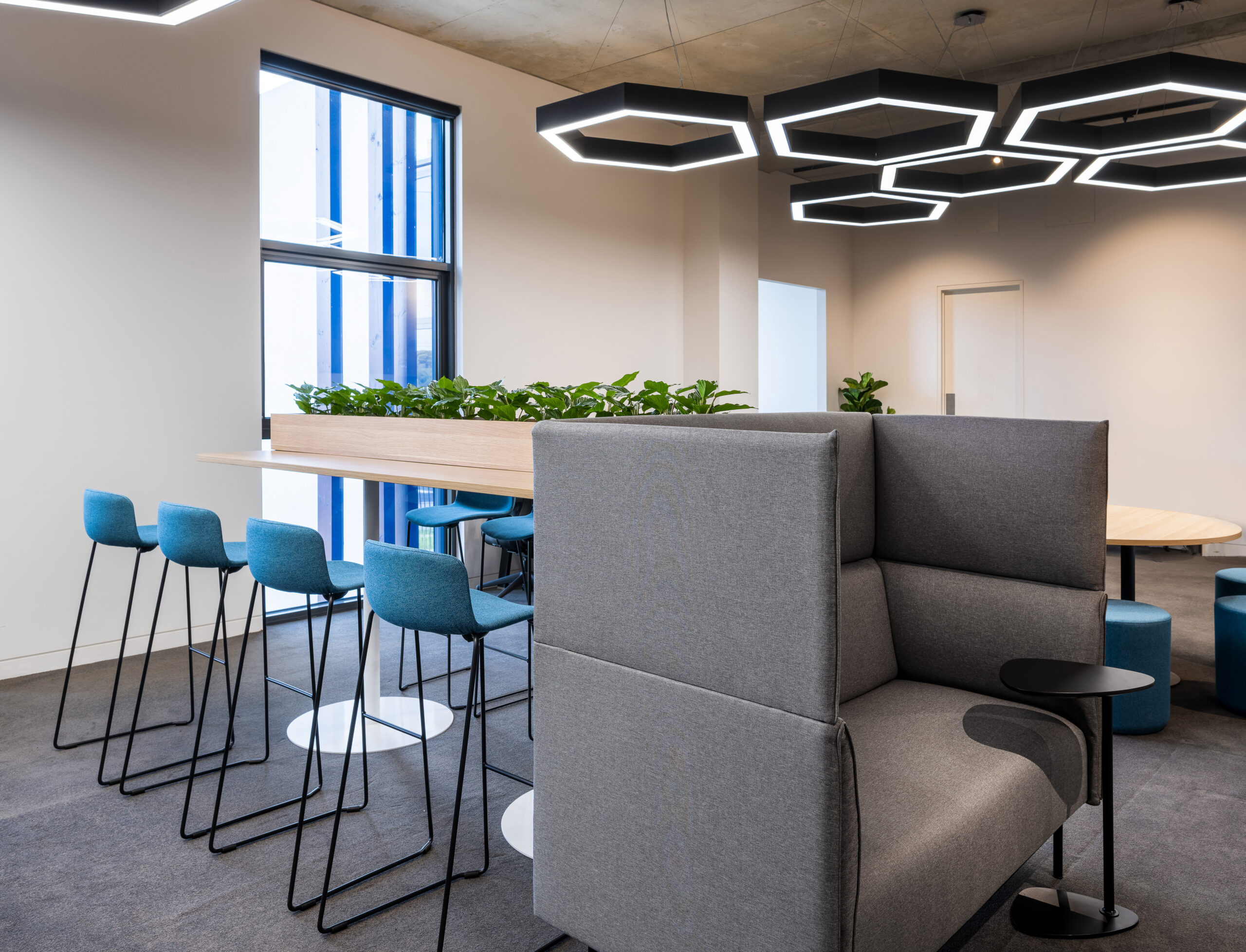 open plan office with stools and soft seating